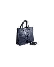 Bolsa de mano azul de las mujeres en la piel